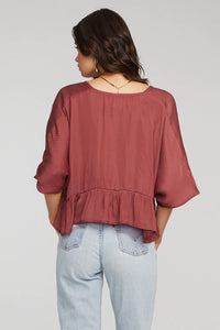flowy wine coloured top with 3 quarter length elasticized sleaves