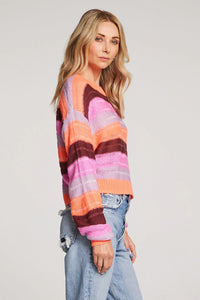 striped loose knit sweater in pink, coral, and burgundy stripes