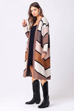 long sweater jacket in brown tones and stripes